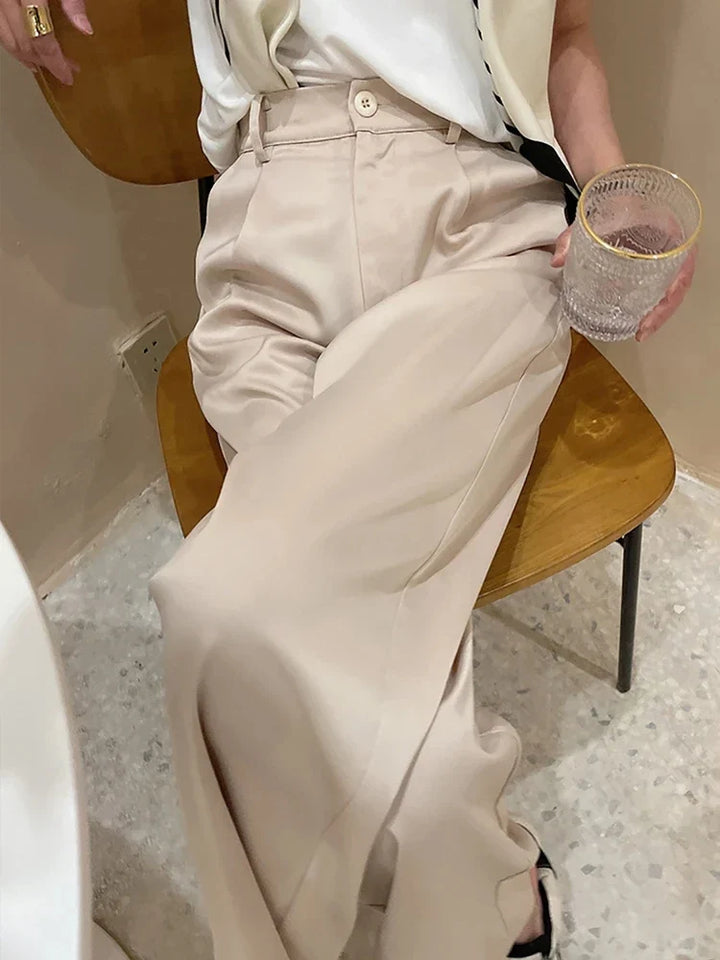 Elegant women's wide-leg pants, high-waisted & full-length, ideal for chic spring fashion.