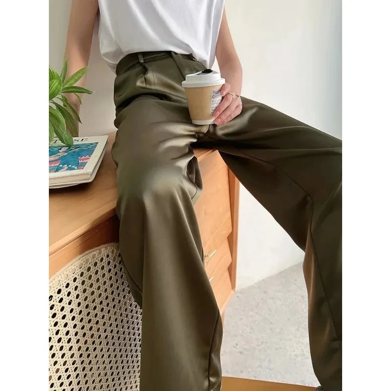 Chic women's wide-leg pants with a high waist and flowy fit, perfect for casual spring fashion.