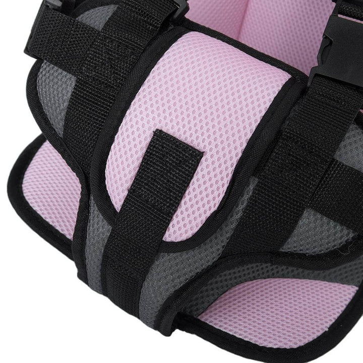 Close-up of the adjustable headrest and shoulder straps on a durable kids' safety car seat.