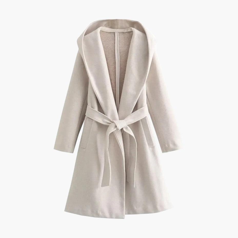 Women's hooded trenchcoat with the hood up, providing ultimate protection. Casual outdoor raincoat.