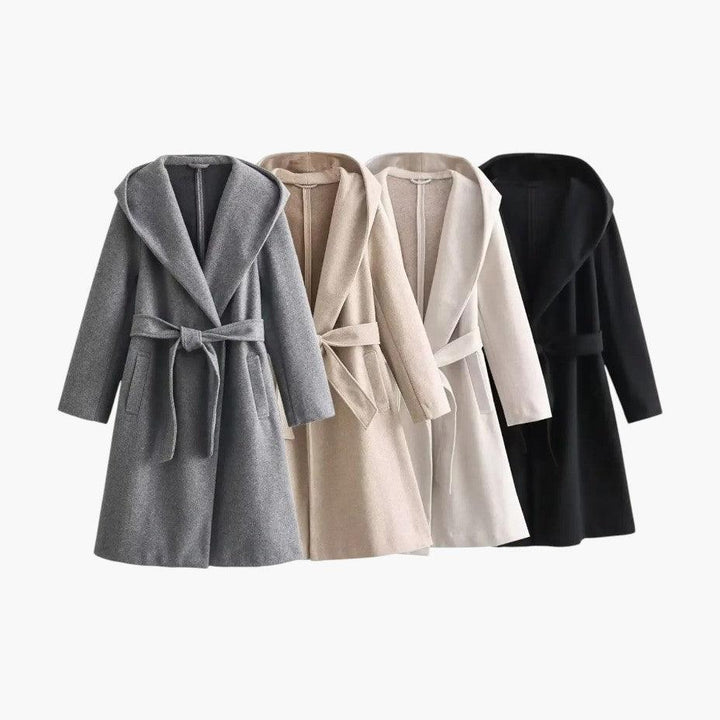Detail of buttons and pockets on a women's casual hooded trenchcoat. Practical outdoor jacket.