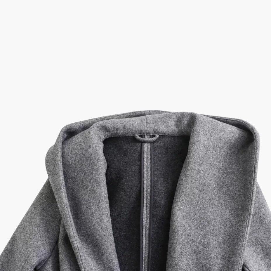 Side profile of women's hooded trenchcoat, belted at waist. Perfect outdoor casual jacket.