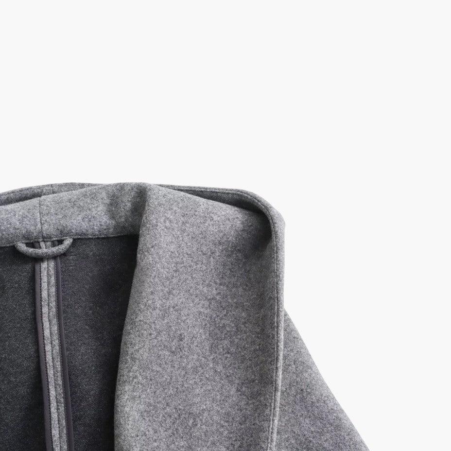 Close-up of the hood on a women's casual trenchcoat. Stylish protection from rain.