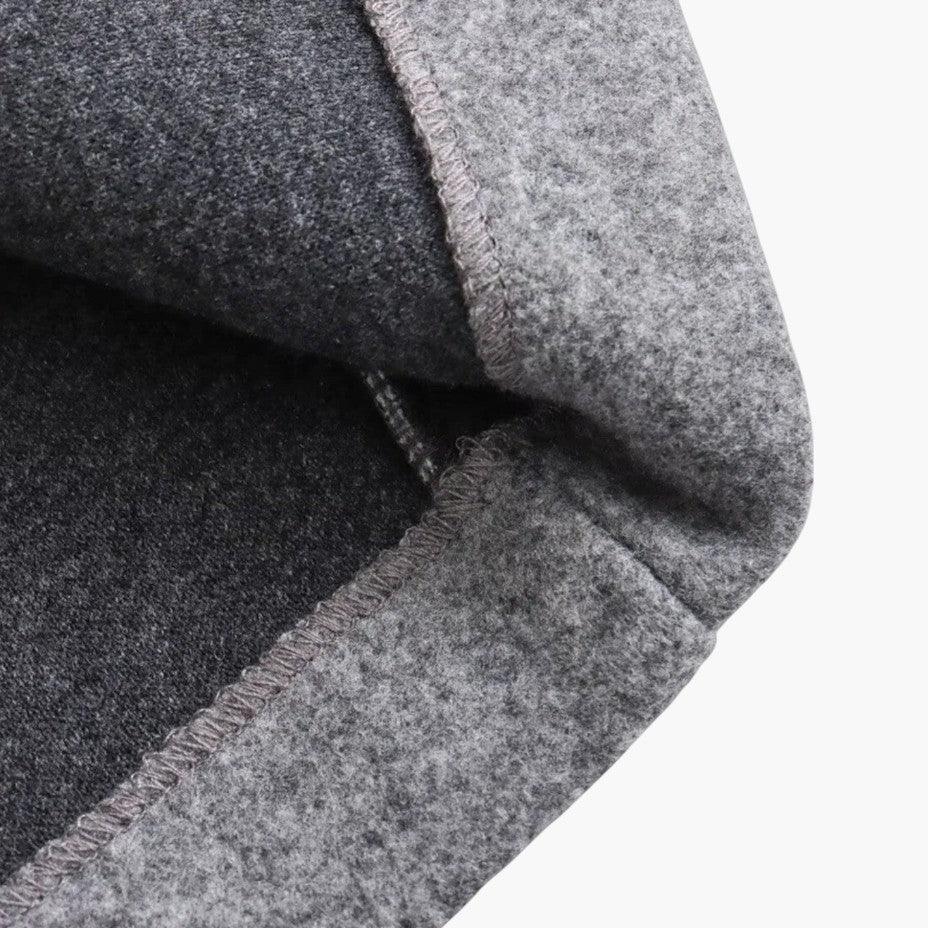 Textured fabric of a women's hooded outerwear trenchcoat, ideal for casual outdoor wear.