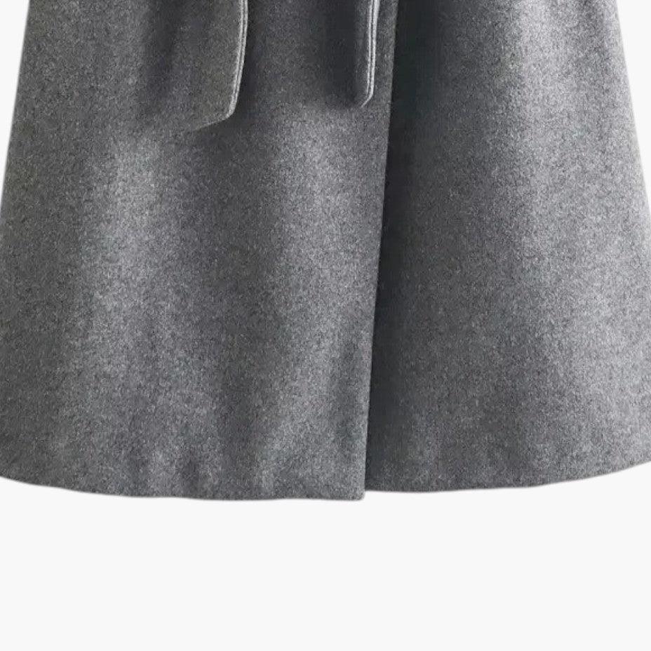 Open women's hooded trenchcoat revealing inner lining, perfect for a layered casual look.