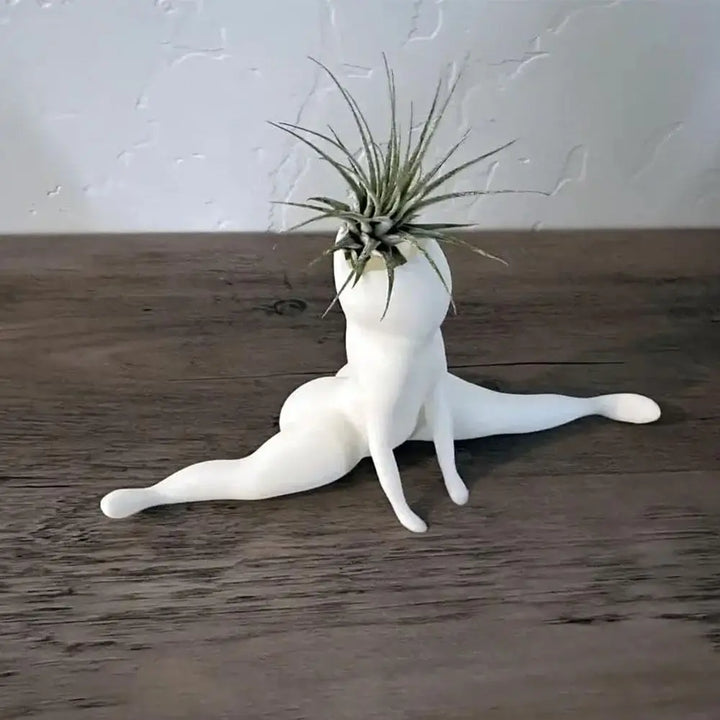 White resin ghost air plant display, a funny and unique spooky decor item for any indoor plant lover.