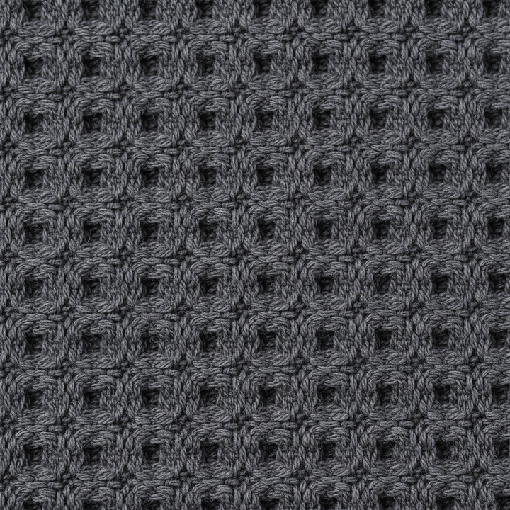 Close-up of GentleCare exfoliating towel, a bath accessory providing gentle body scrub with bamboo charcoal