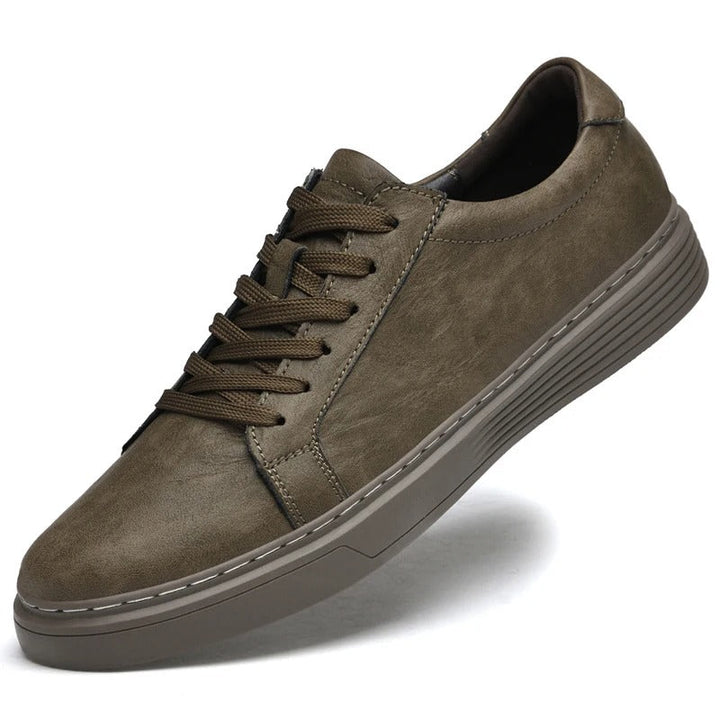 Durable genuine leather men's sneakers, perfect for casual footwear & everyday style.