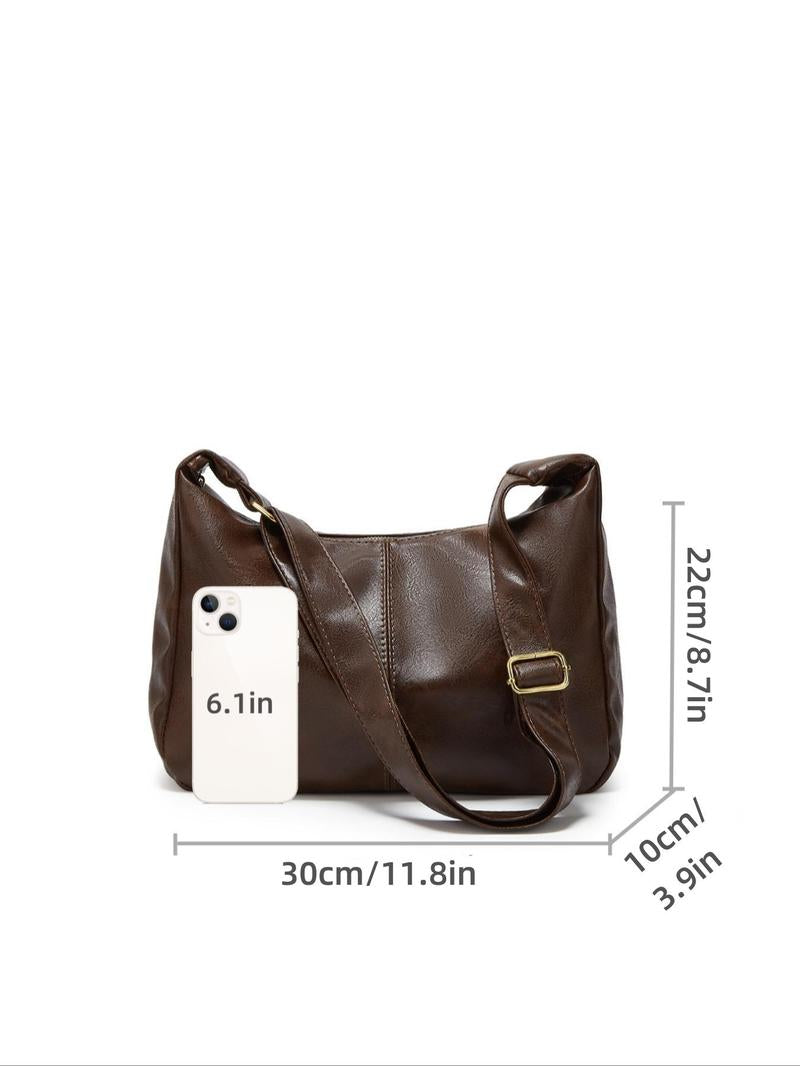 Classic black genuine leather shoulder bag for women, versatile & durable everyday accessory.