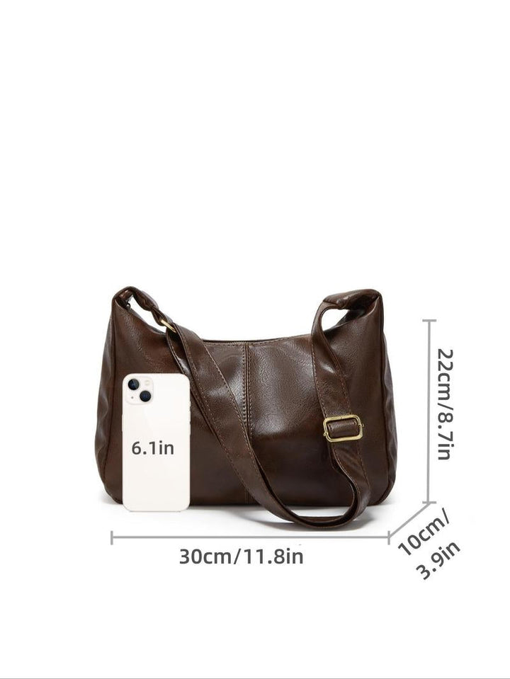 Classic black genuine leather shoulder bag for women, versatile & durable everyday accessory.