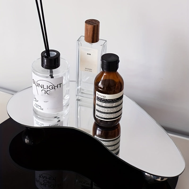 Elegant acrylic geometric tray for tabletop organization of candles, diffusers, and decor items.
