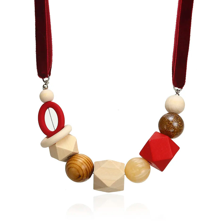 Women's geometric statement necklace with pearls & wood. Adjustable, modern design, a perfect gift.