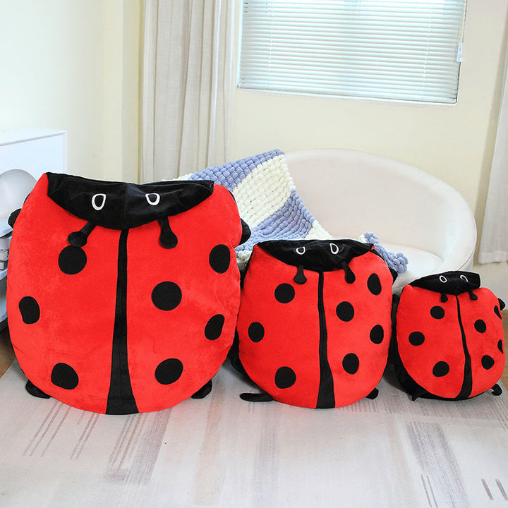 Soft, giant red ladybug plush animal pillow with black spots, designed for kids' cozy comfort and imaginative play.