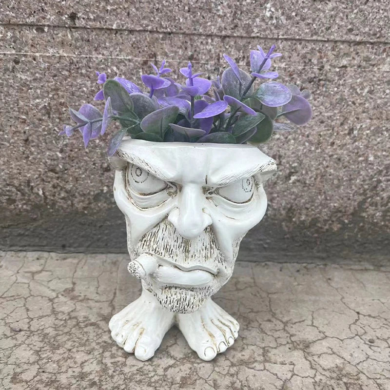 Cute GigglePot Funny Face Planter, a whimsical resin pot for succulents, adds unique charm to any indoor space.
