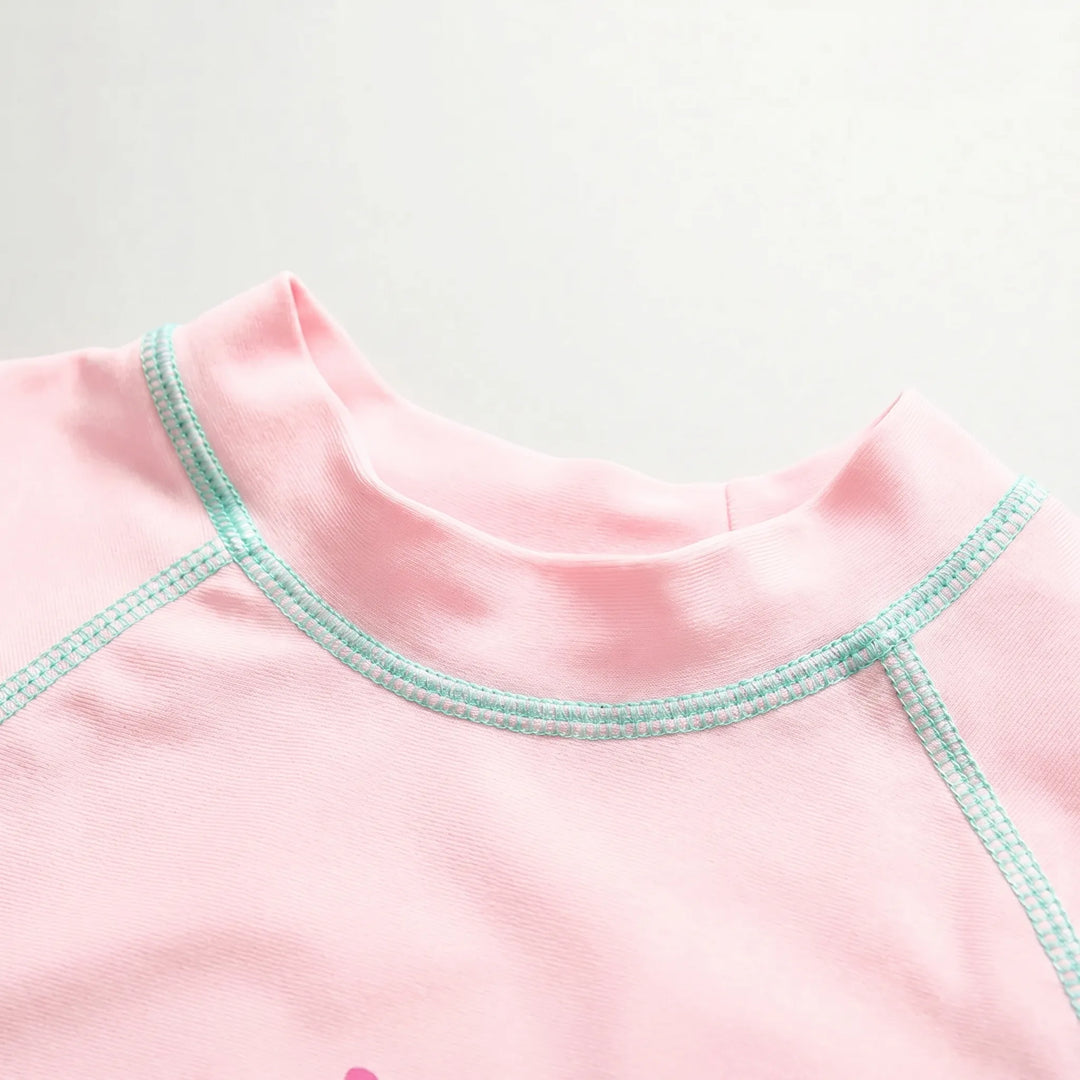 Stylish girls' three-piece floral rash guard swimwear set, providing UPF 50+ sun protection with hat.