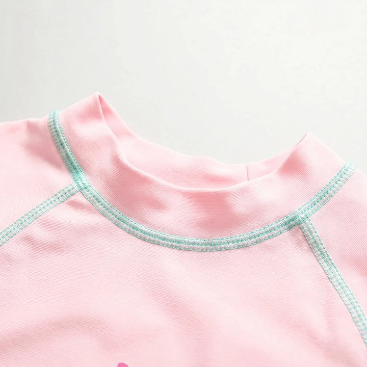 Stylish girls' three-piece floral rash guard swimwear set, providing UPF 50+ sun protection with hat.