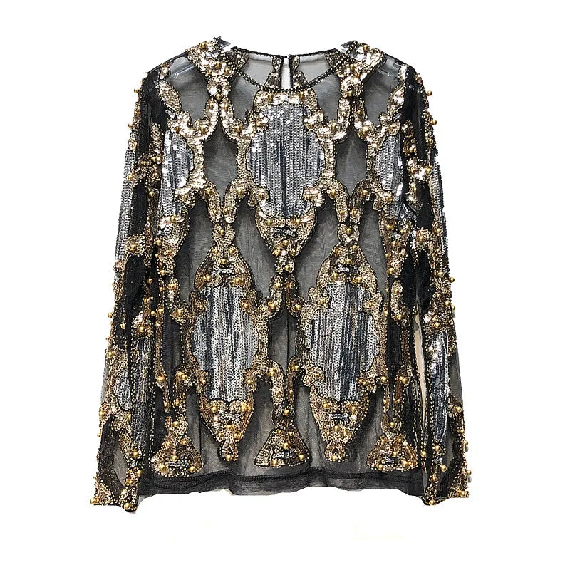 Women's shimmering black and gold sequin party top, an elegant and glamorous addition to evening wear.