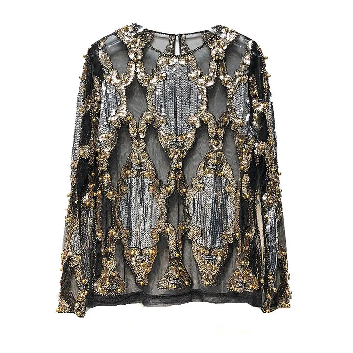 Women's shimmering black and gold sequin party top, an elegant and glamorous addition to evening wear.