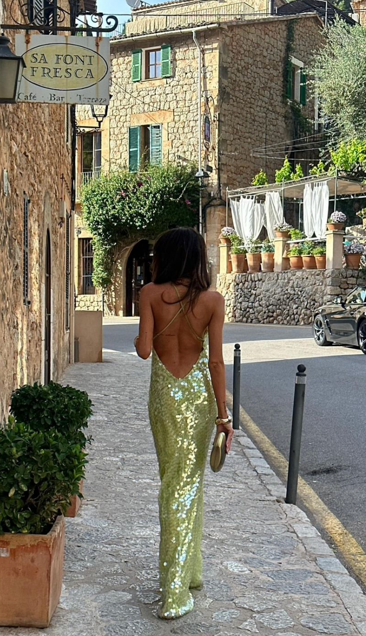Elegant women's green sequin backless evening gown, a glamorous choice for any special occasion or formal event.