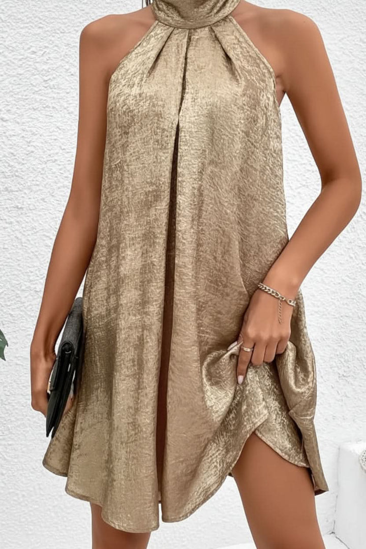 Glamorous women's radiant gold halter backless two-piece mini skirt set, perfect for parties & summer evenings.