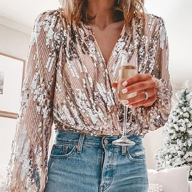 Women's long-sleeve sequin blouse in a glamorous design, ideal for festive attire & evening fashion.