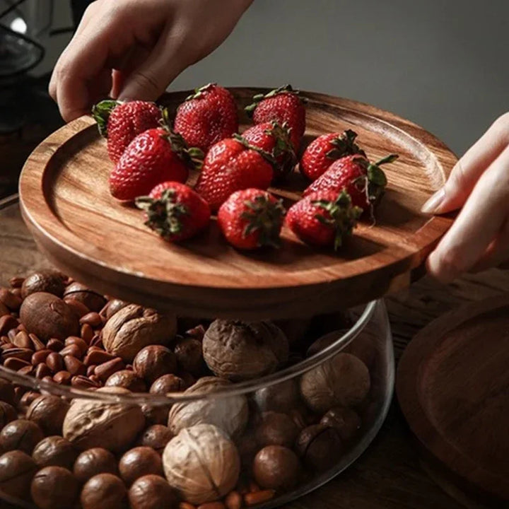 Clear glass serving bowl with a natural acacia wood lid, perfect for fruits, salads, or snacks in any kitchen.