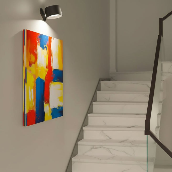 Sleek GLOW360 wireless LED wall lamp. Pivots for adjustable lighting, magnetic mount, touch control.