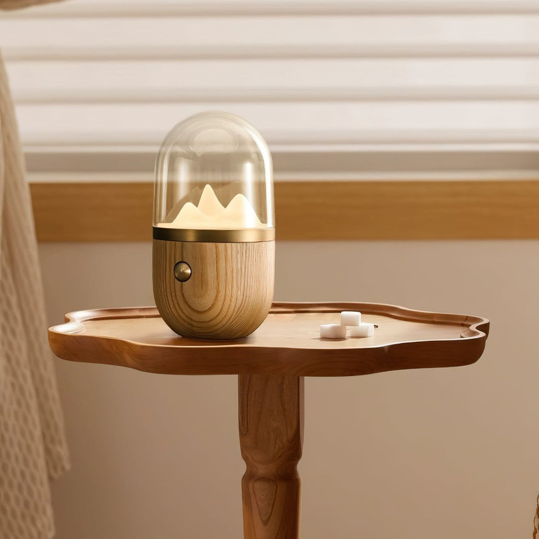 Perspective view of Glowcrest's wooden tabletop lamp with a matte glass shade, emitting a warm, inviting ambient light