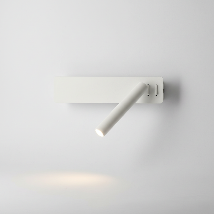 Swivel LED wall lamp, GlowFocus, providing focused task lighting for a book
