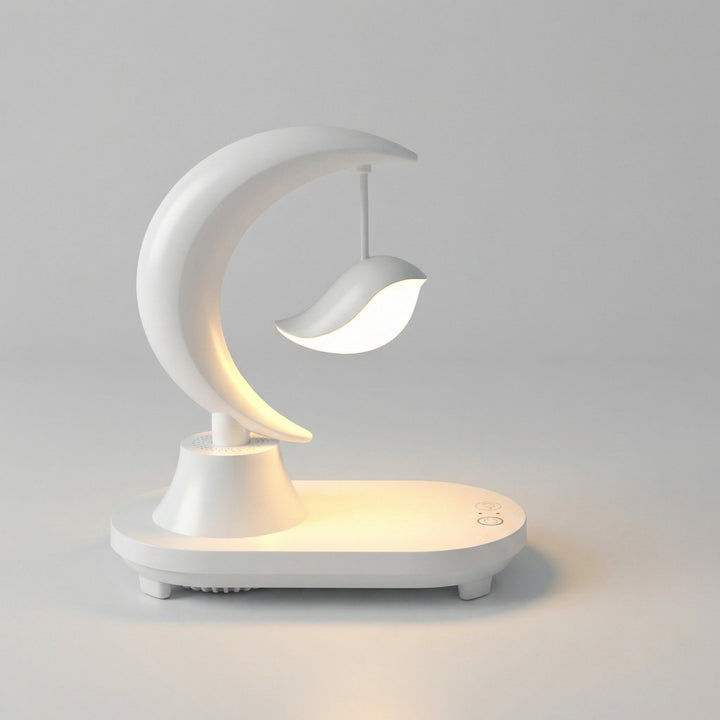 Portable Glowmoon Bluetooth Bedside Lamp, featuring wireless phone charging and a soft LED night light for versatile use.