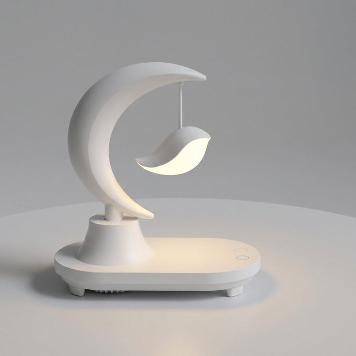 Adjustable LED bedside lamp with integrated wireless charging pad and quality Bluetooth speaker, ideal for any room.