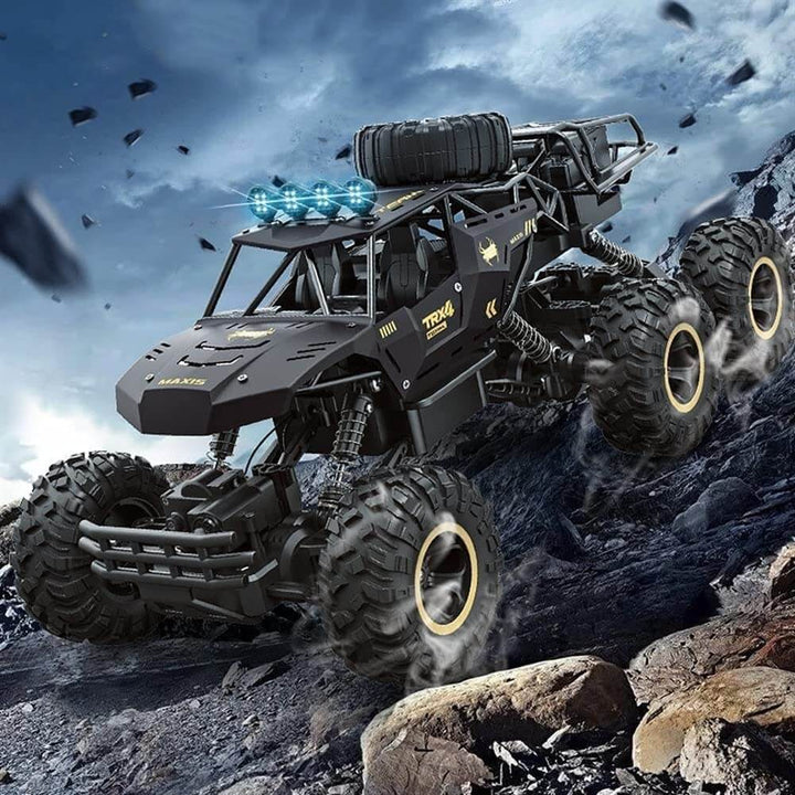 Powerful, durable gold & black 6x6 RC monster truck for challenging off-road play & adventure. Rechargeable.