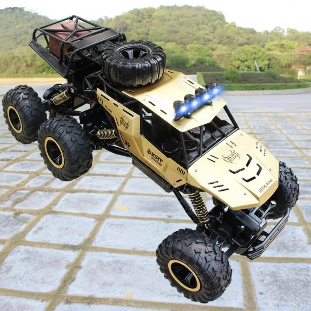 Unstoppable gold & black 6x6 RC monster truck, perfect for powerful all-terrain remote control action.