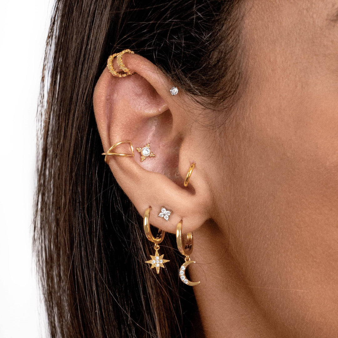 Sterling silver dangle earrings with delicate gold plated moon and star celestial design.