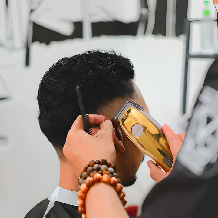 Cordless gold fade clipper for precision men's haircuts & beard trimming, barber tools.