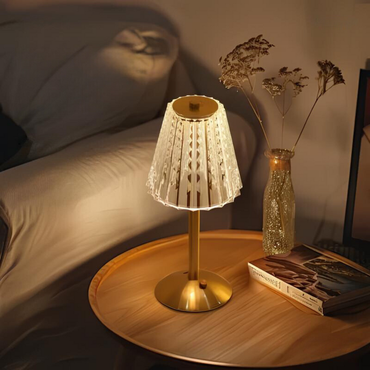 Ambient lighting provided by a rechargeable golden crystal touch lamp, enhancing room atmosphere