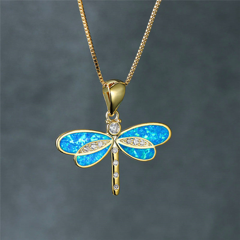 Statement nature-inspired dragonfly jewelry, a women's gold-plated opal pendant on sterling silver.