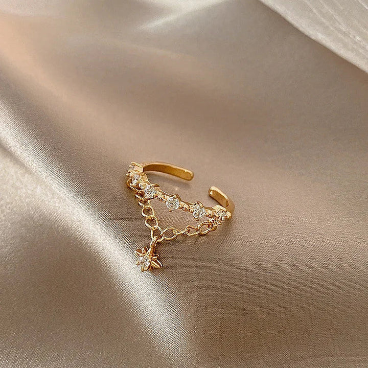 Close-up of a women's elegant golden hexagram chain ring, perfect for a modern look.