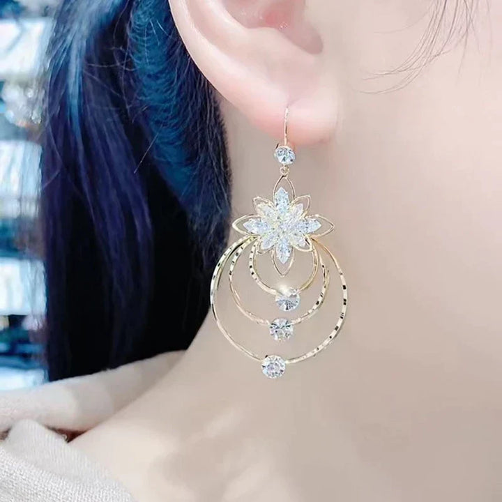 Elegant women's golden hoops, perfect glamorous jewelry for any occasion.