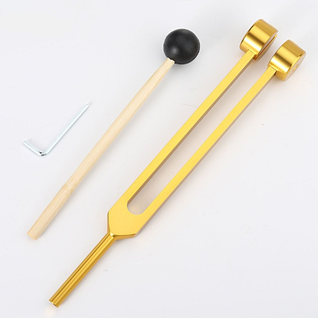 Relaxation aid: golden tuning forks for stress relief & energy balance.