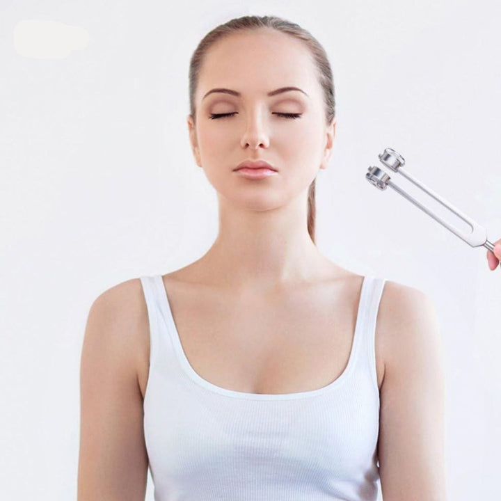 Unisex tuning fork set for meditation, stress relief, and wellness.