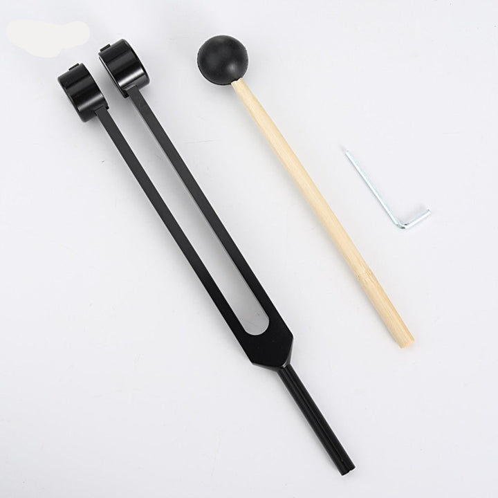 Golden tuning forks, enhancing spiritual practices & energy balance.