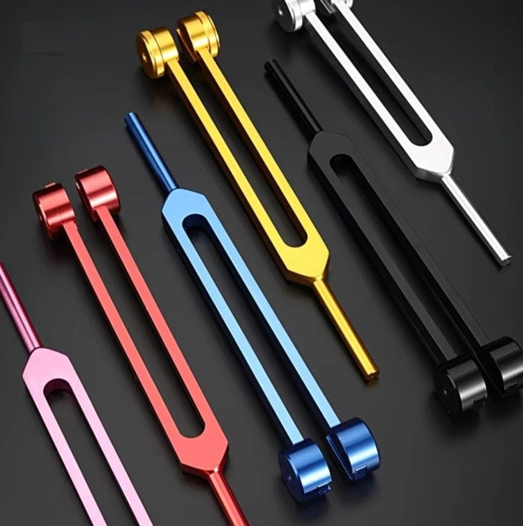 Premium golden tuning forks, essential for sound therapy & stress relief.