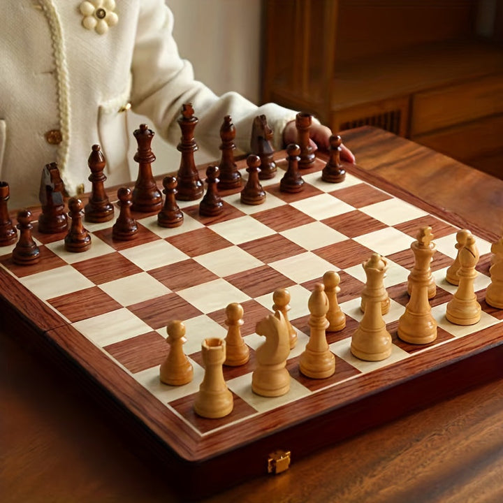 Pieces of a solid wood chess set neatly stored inside its wooden box, ready for play