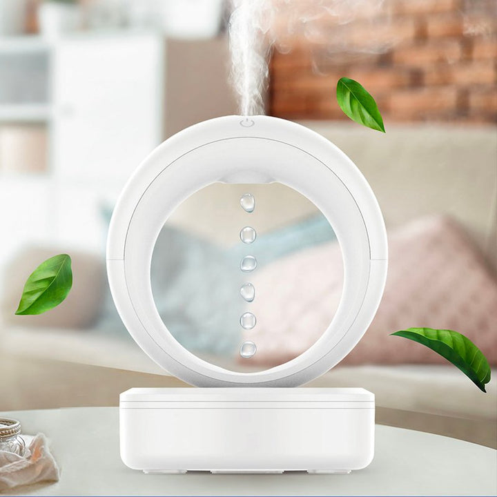 Sleek white GravityFlow humidifier & aroma diffuser, featuring a captivating optical illusion for modern home decor & relaxation.