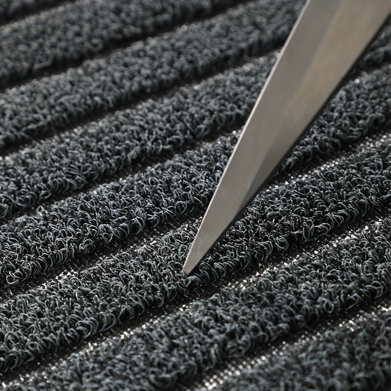 Gray WeatherGuard Pro mud mat, an all-season indoor outdoor door mat with strong PVC backing for durability.