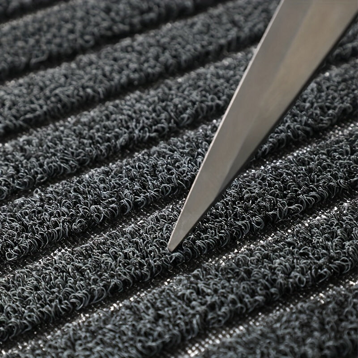 Gray WeatherGuard Pro mud mat, an all-season indoor outdoor door mat with strong PVC backing for durability.
