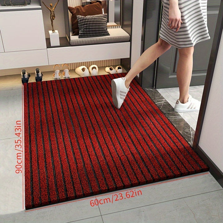 Red WeatherGuard Pro welcome mat, an all-season durable entryway rug with mud-trapping features.