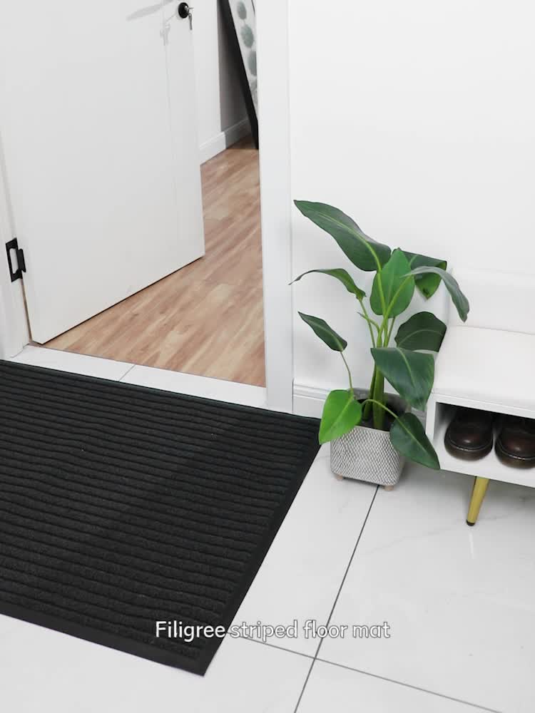 Gray all-season indoor outdoor mat, WeatherGuard Pro, with non-slip PVC backing for high traffic areas.