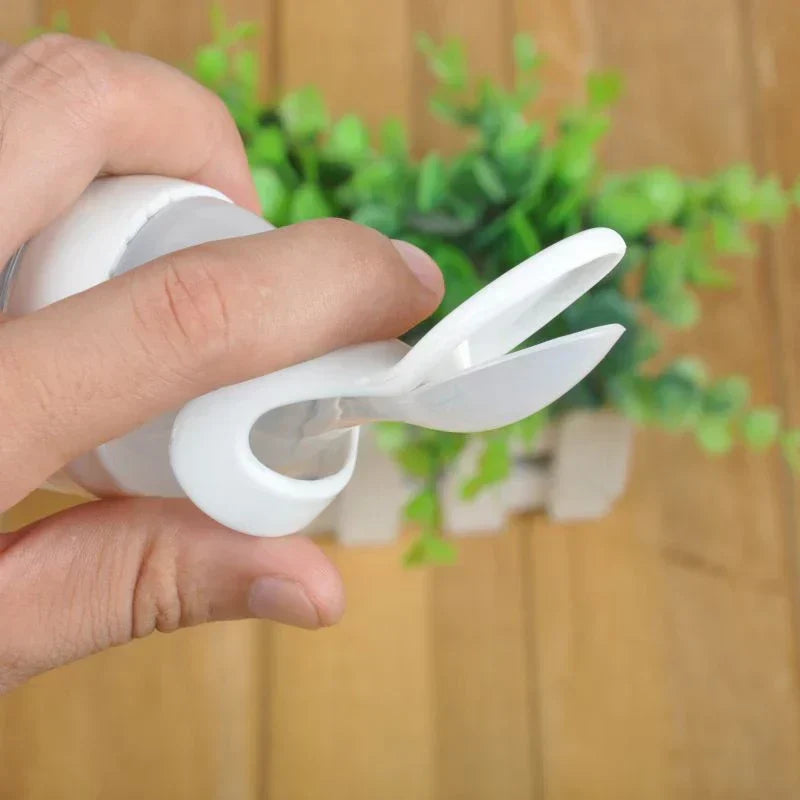 Green & blue silicone baby feeding spoon bottles, BPA-free, for easy infant & toddler meals.